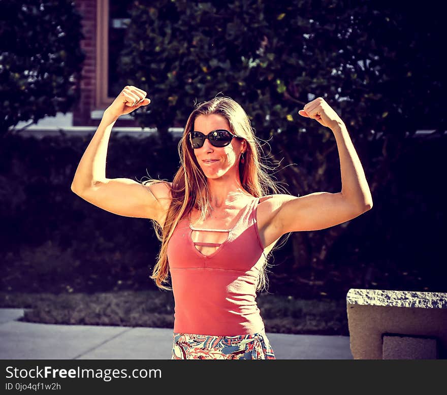 Woman Showing Muscles