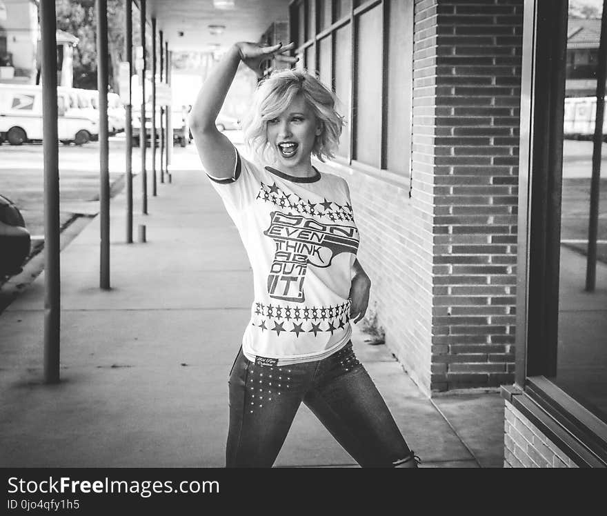 Grayscale Photo of Woman Wearing White T-shirt