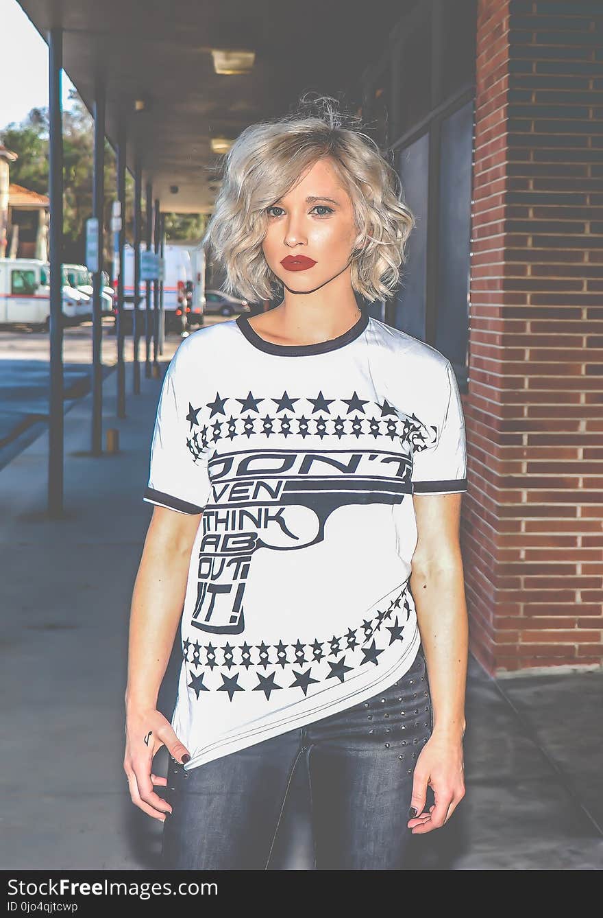 Woman in White and Black Gun-printed Crew-neck Shirt