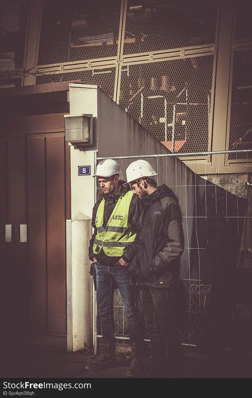 Two Men Wearing White Hard Hat