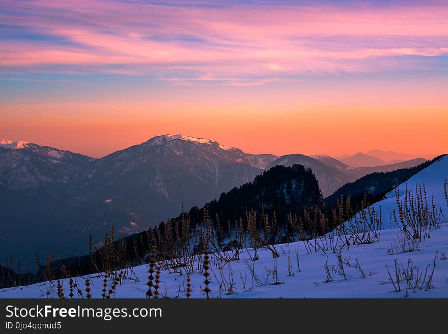 Mountain Ranges during Orange Sunset