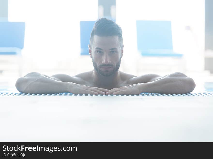 Happy Attractive Man Resting Relaxed On Edge Of Swimming Pool. Happy Attractive Man Resting Relaxed On Edge Of Swimming Pool