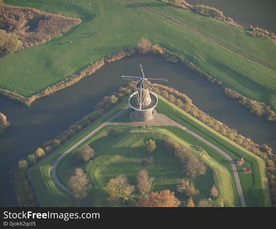 Grain mill named Nooit Volmaakt in the center of city Gorinchem in the Netherlands, picture taken from a hot air balloon