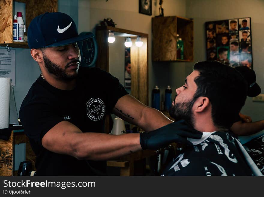 Person Standing Holding Neck of Man Inside Room