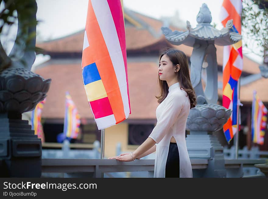 Woman Standing in Front of Banner