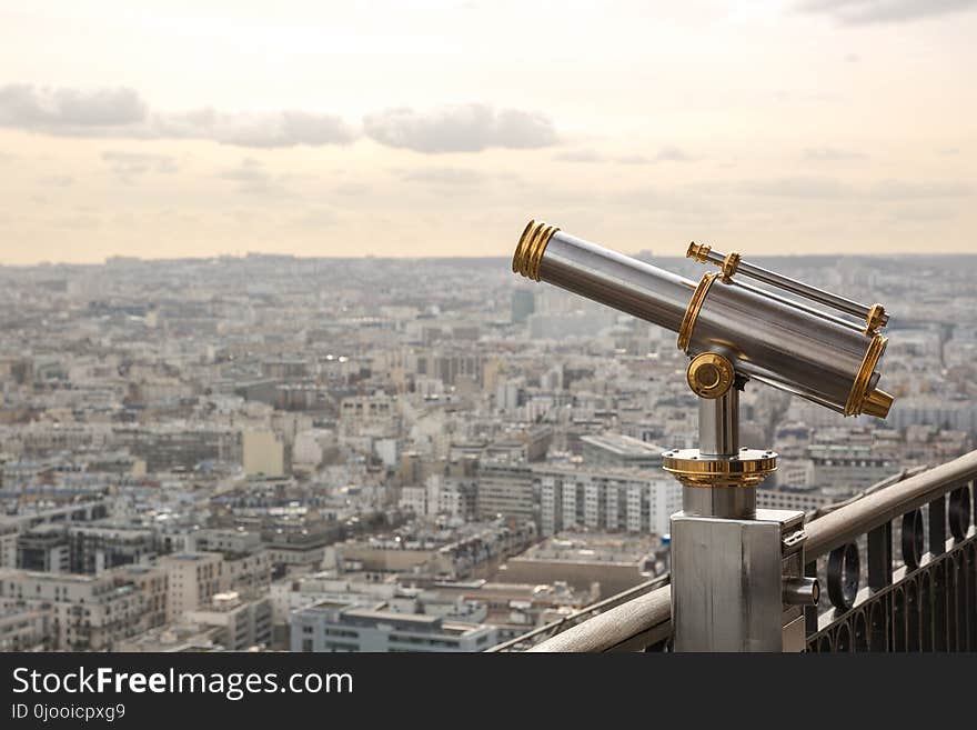 Gray and Gold Telescope on Building