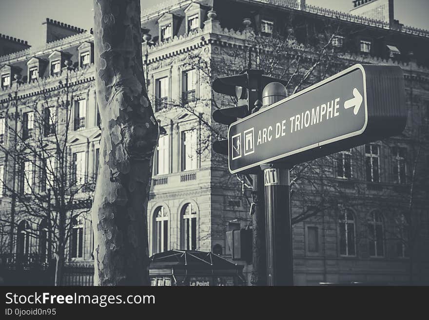 Grayscale Photo of Black and White Arc De Triomphe Street Sign