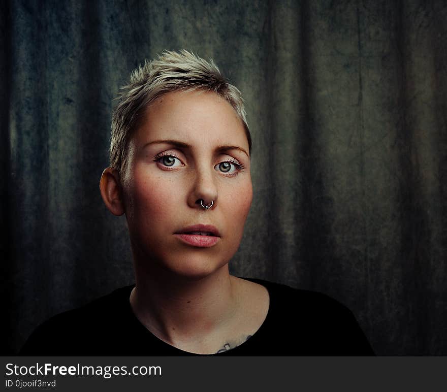 Woman With Silver-colored Septum Piercing