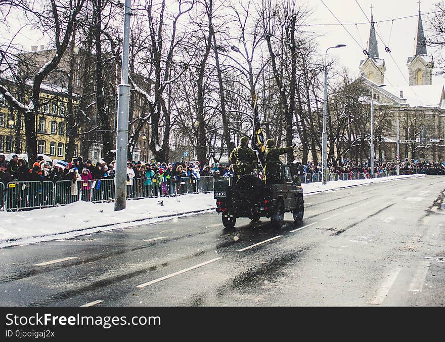 Soldiers Riding a Vehicle during a Parade