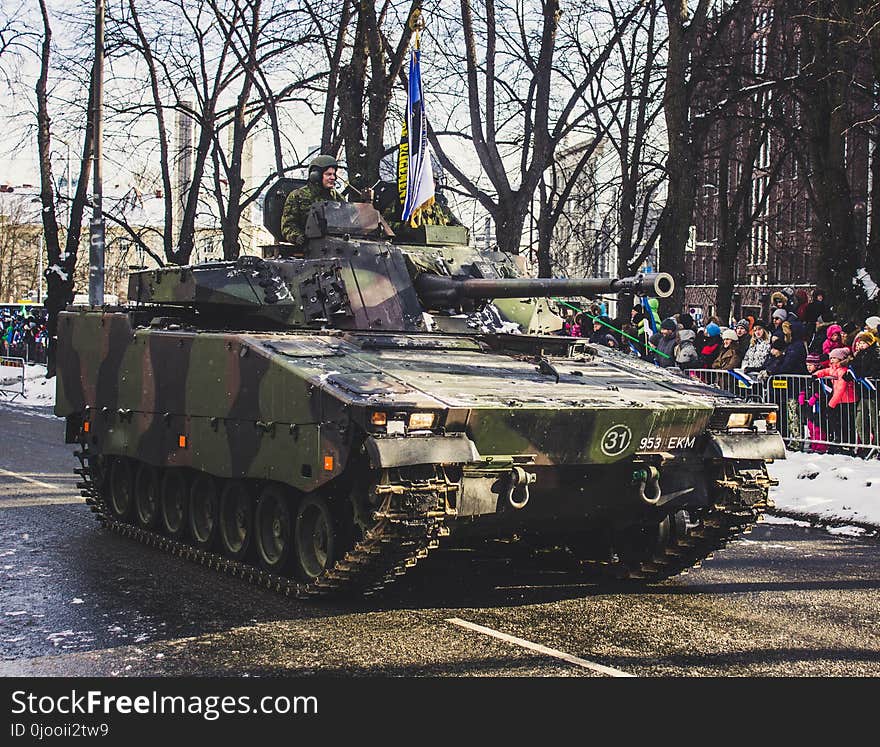 Black and Green Camouflage Military Tank Parade