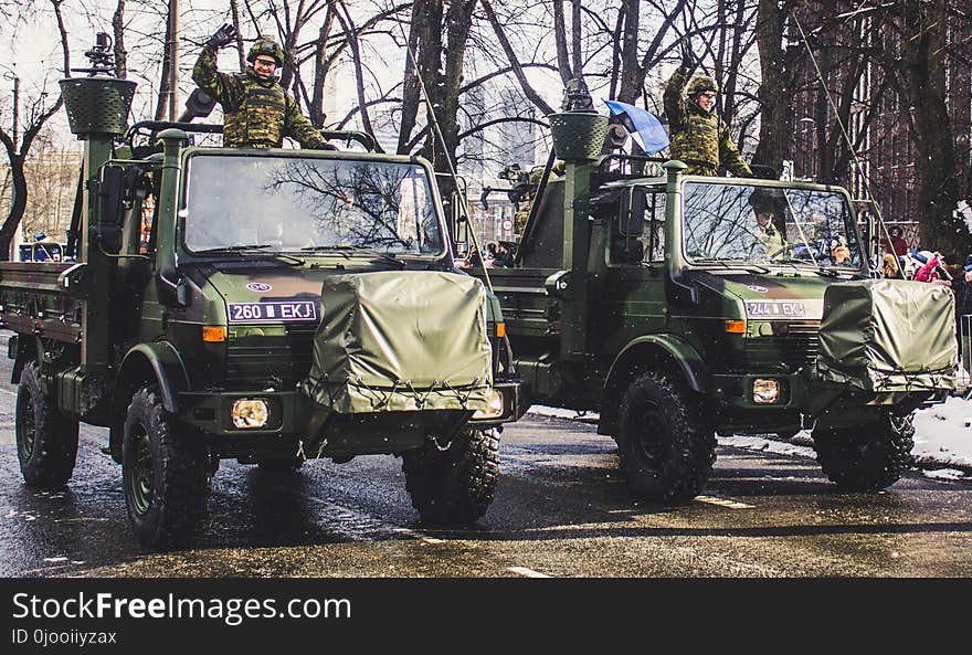 Soldiers Riding on Trucks