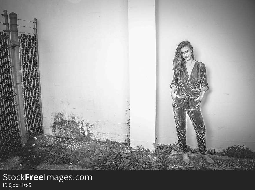 Woman in Surplice-neckline Blouse and Pants Outfit Grayscale Photography