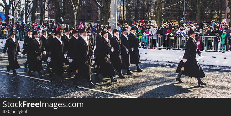 Group of People March on Road