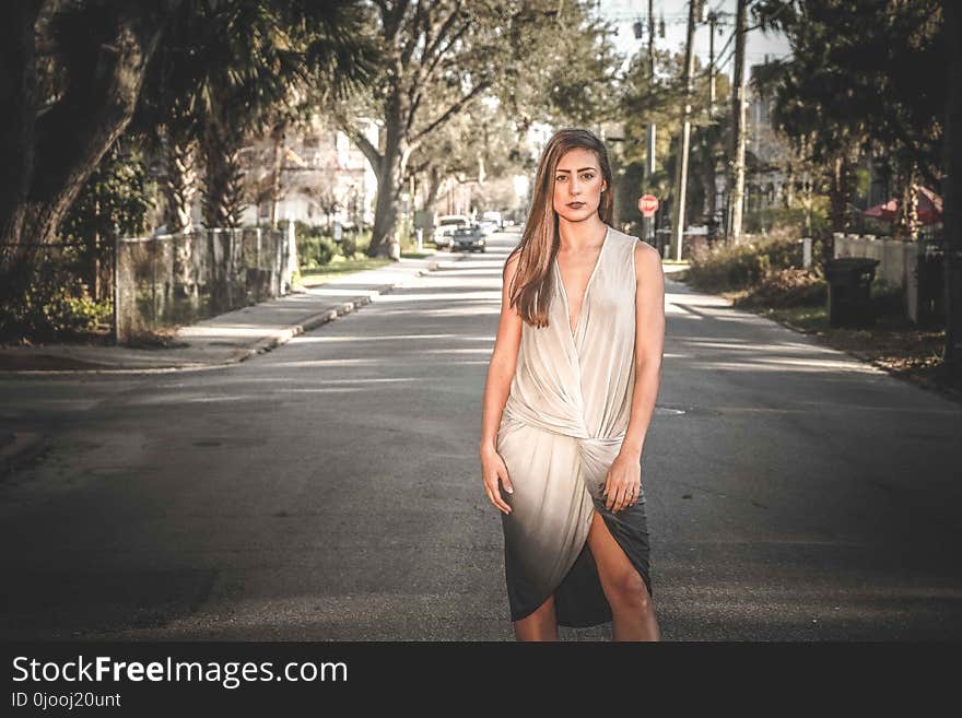 Woman in White and Black Sleeveless Dress