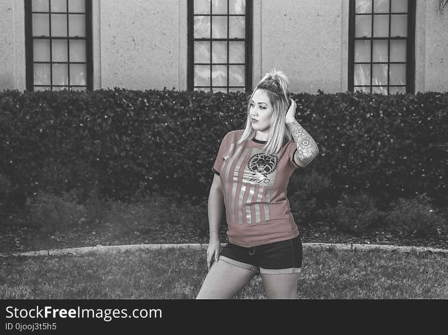 Woman Wearing Red Crew-neck Shirt With Black Short Shorts