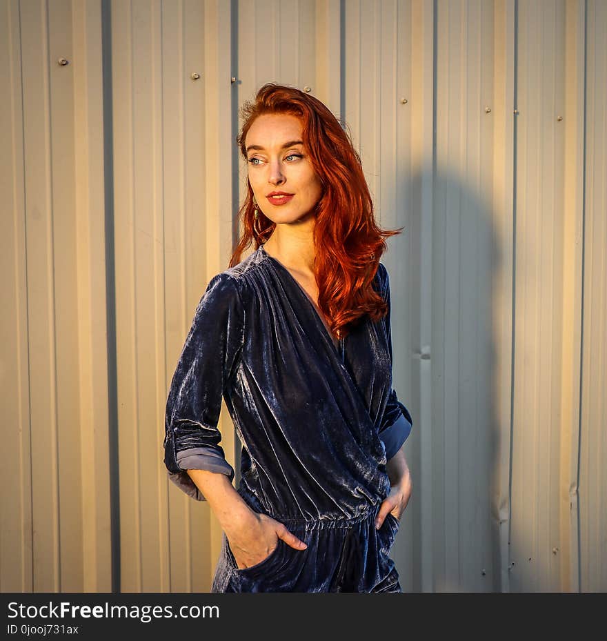 Woman Standing With Both Hand on Pocket