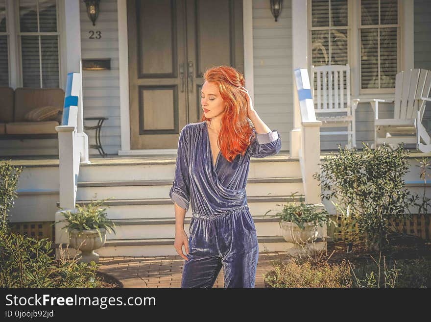 Red Haired Woman Wearing Blue Long-sleeve Jumpsuit