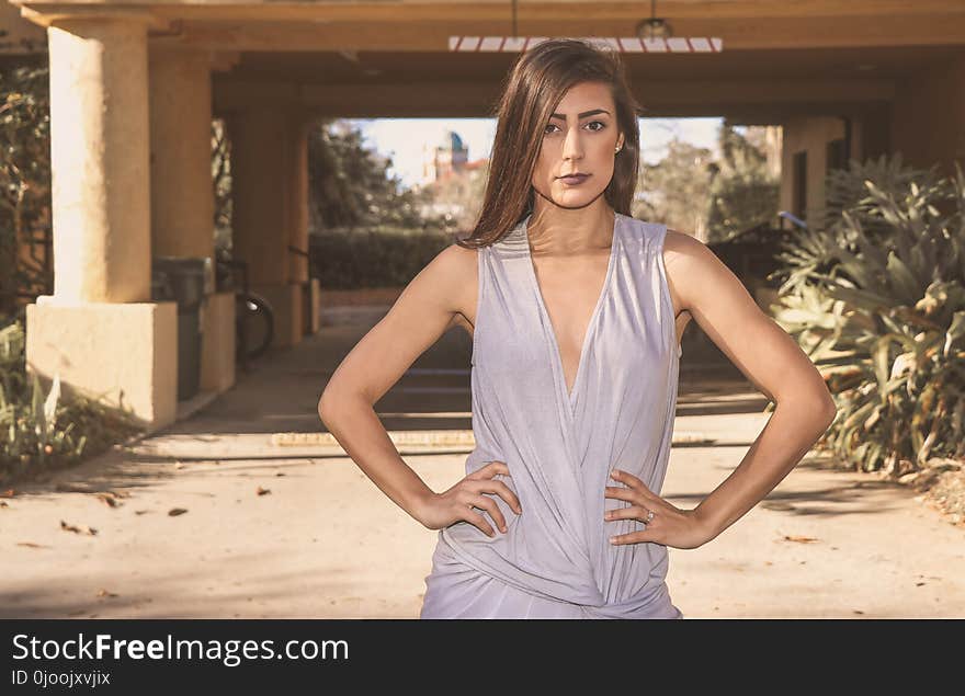 Woman Wearing White Sleeveless Dress