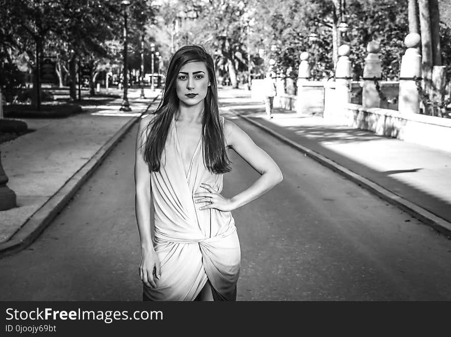 Woman Wearing Dress Standing on Grey Concrete Road