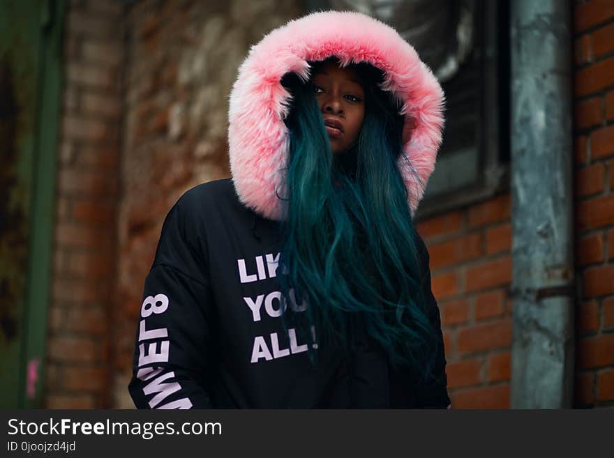 Shallow Focus Photography Woman in Black and Pink Parka Jacket