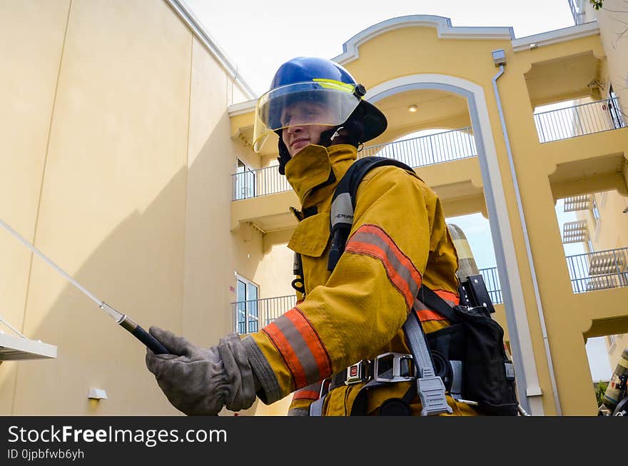 Photo of Firefighter Beside Building