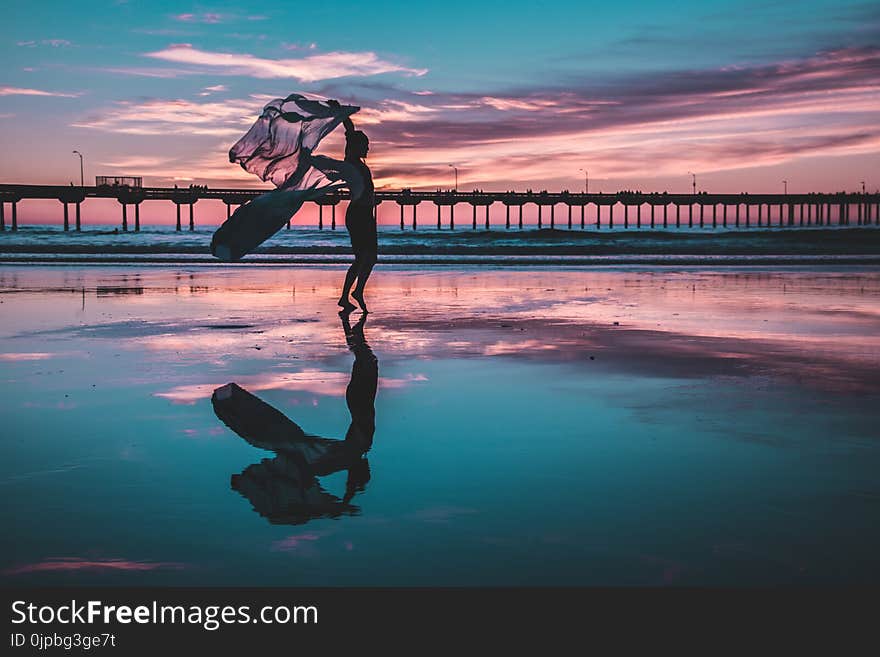 Woman Standing on Shallow Water