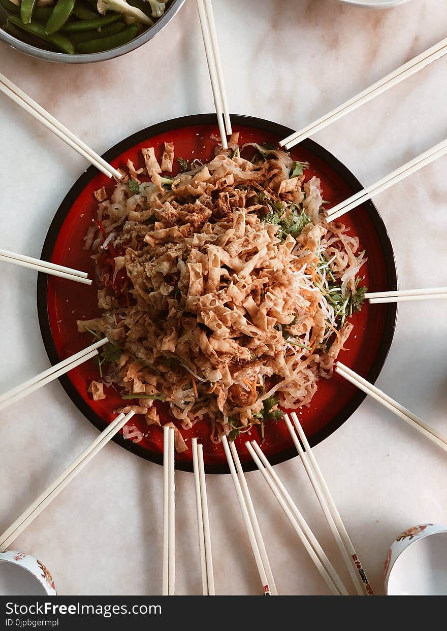 Pasta Served on Plate With Chopsticks