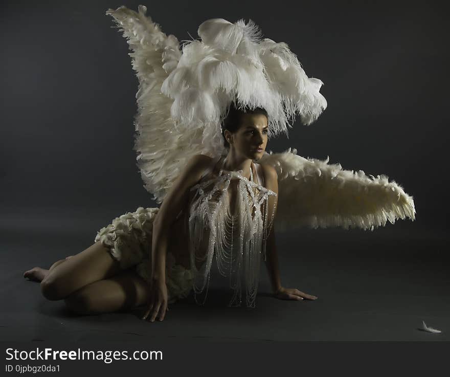 Woman in White Wings With Headdress