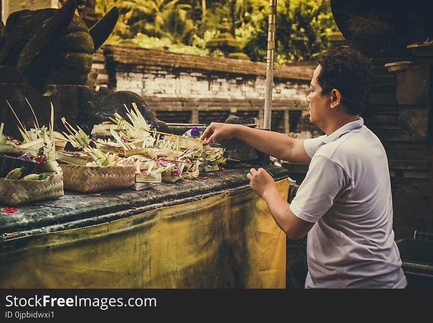 Man Fixing Flower Arrangements