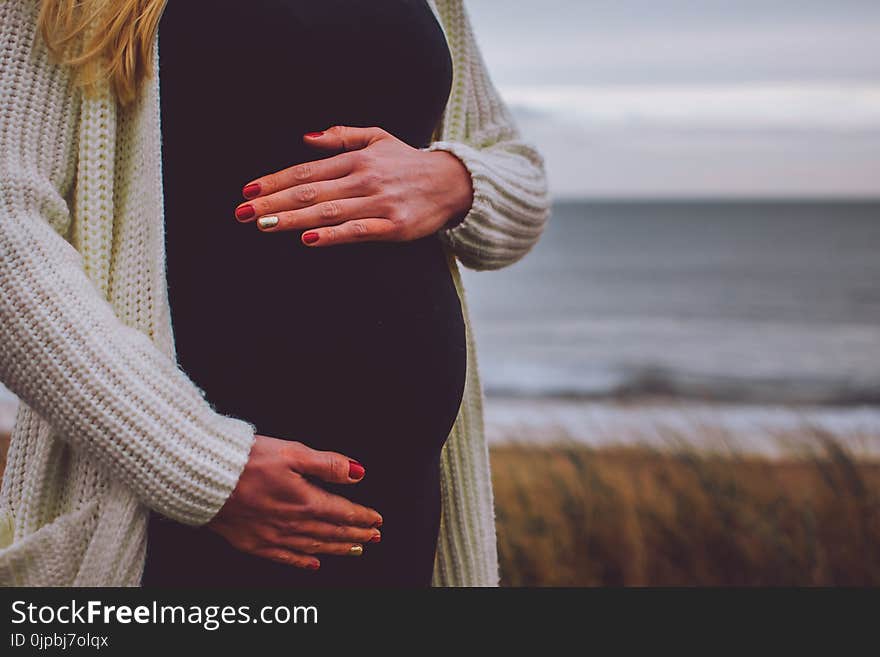 Woman Pregnant Standing Near Beach