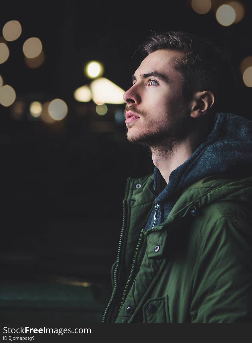 Man Wearing Green Zip Jacket