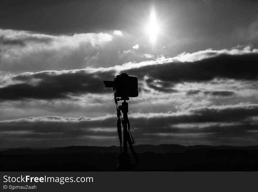 Grayscale Photo Of Camera Under The Sun