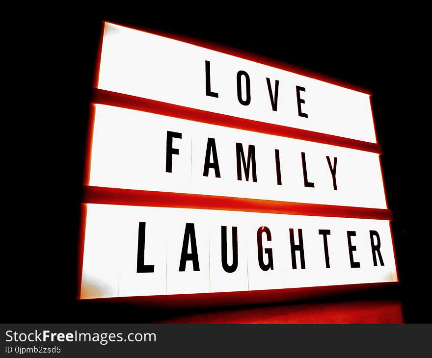 White and Red Led Signage With Love Family Laughter Text