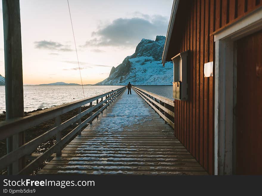 Man Standing On Pier