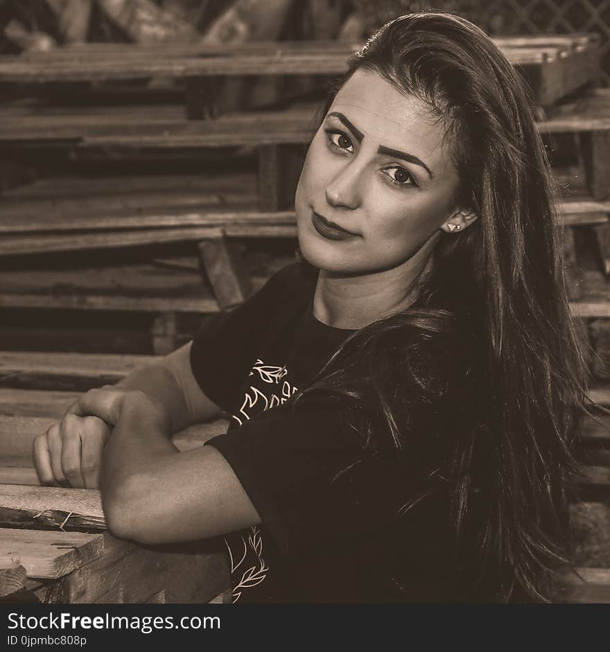 Woman Wearing Black Shirt Sitting