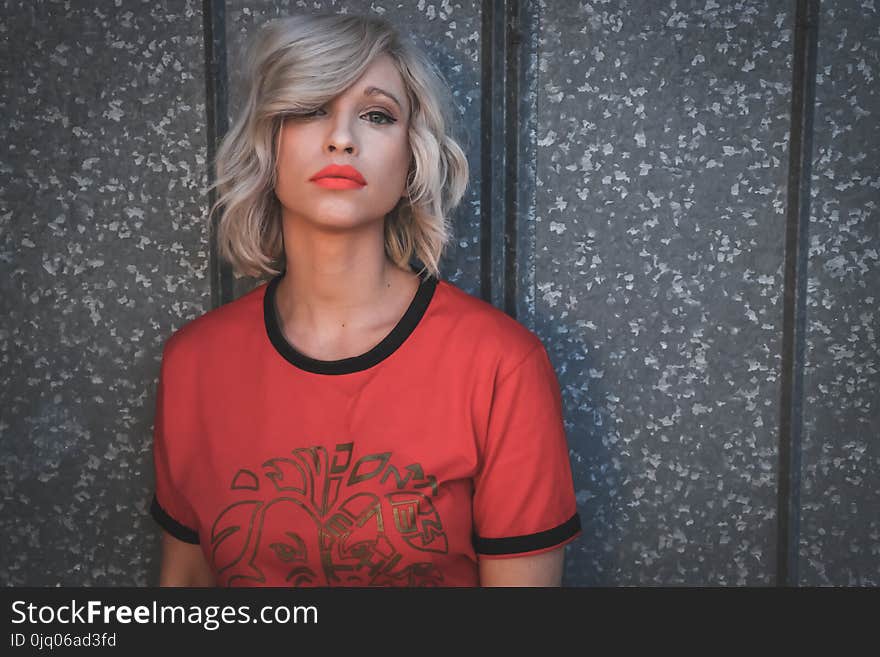 Woman Wearing Red Shirt on Gray Background