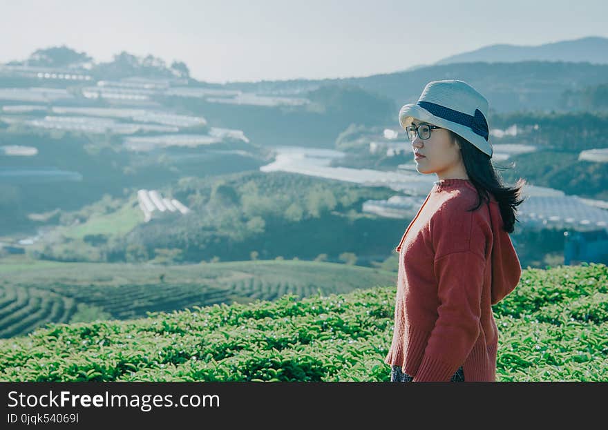 Side View of Woman on Top of the Mountain