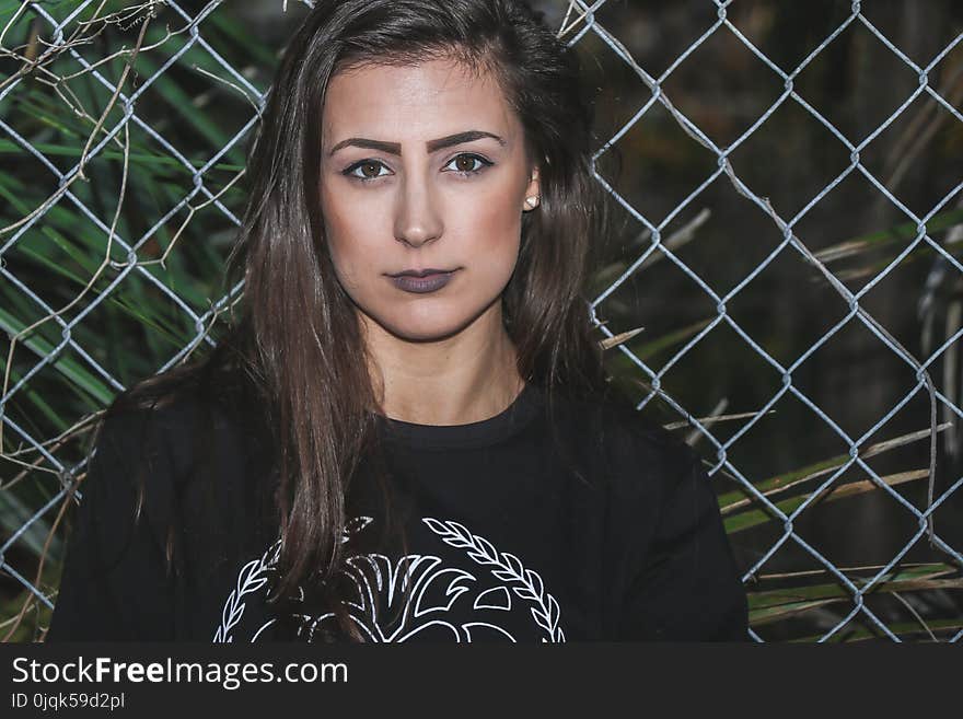 Photo of Woman Wearing Black Crew Neck Shirt