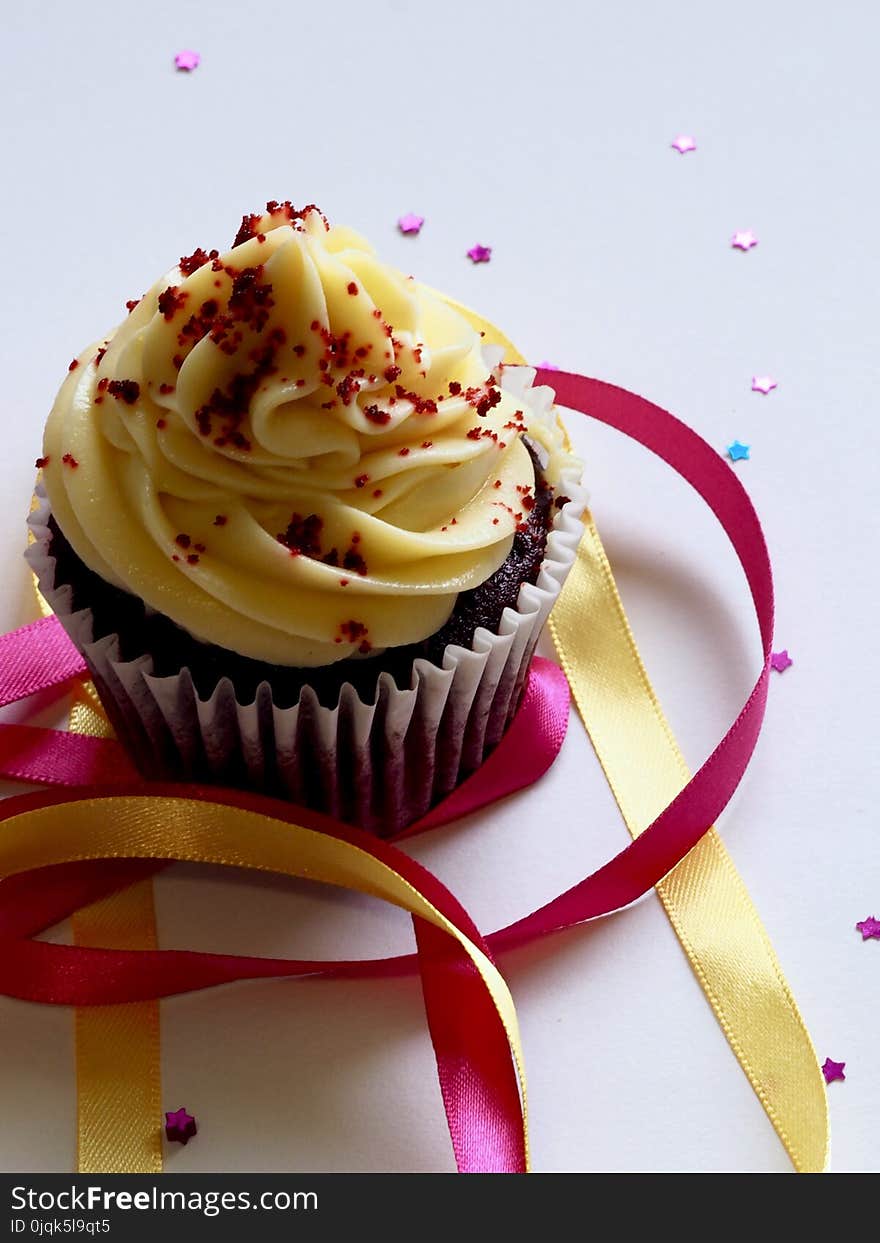 Chocolate Cupcake With White and Red Toppings