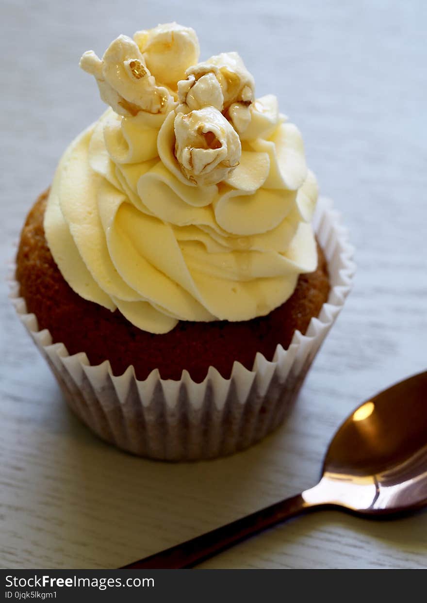 Chocolate Cupcake With Yellow Icing On Top