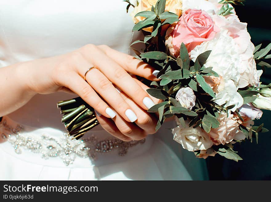 Woman Holding White and Pink Roses Bouquet