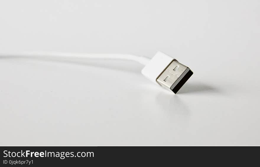 Close-Up Photo of White Usb Cable