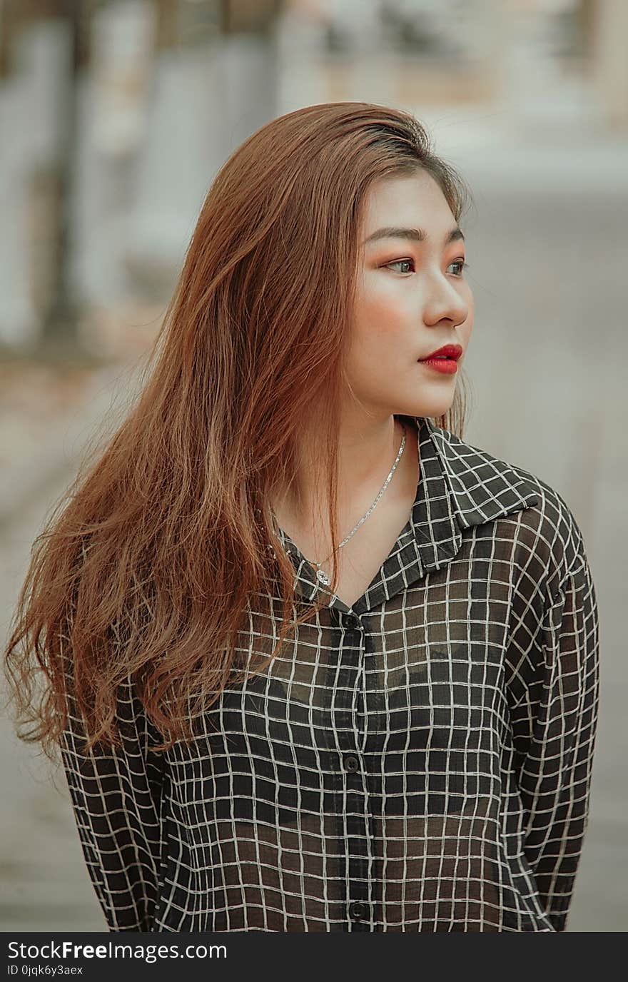 Woman Wearing Black and White Checkered Dress Shirt