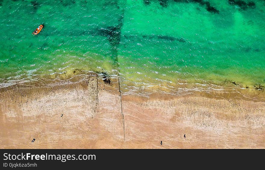 Brown Boat on Body of Water