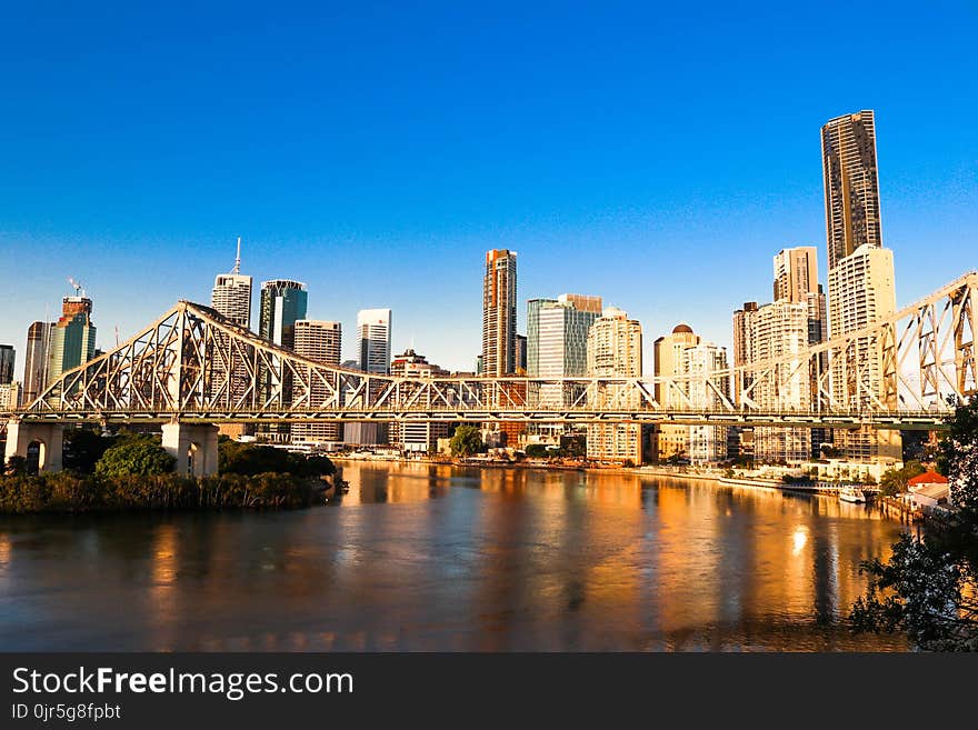 Gray Bridge Near City Buildings