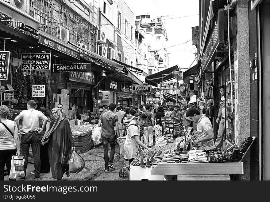 Grayscale Photo of People in the Market