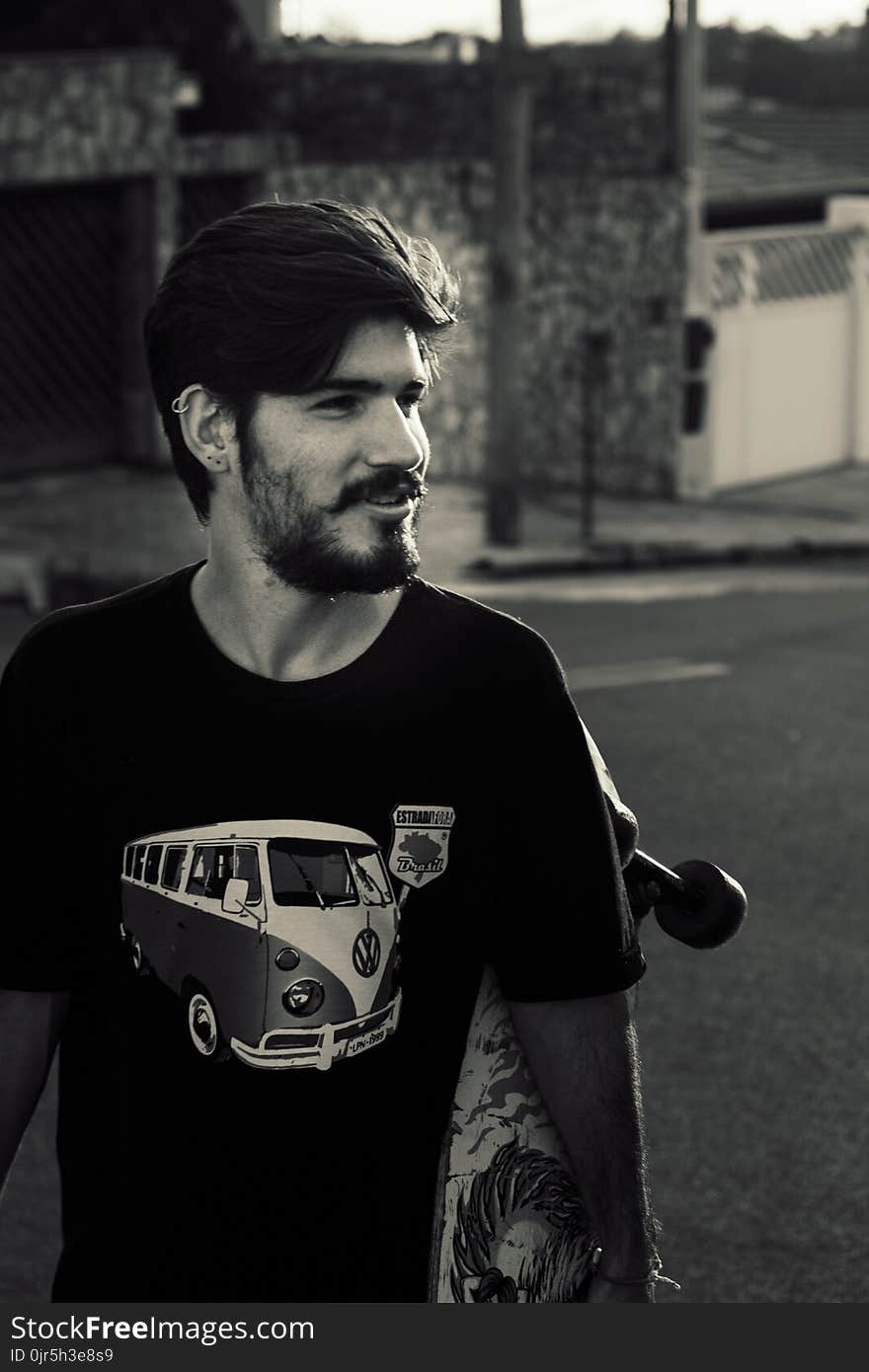 Grayscale Photography of a Man Wearing Black Crew-neck Shirt