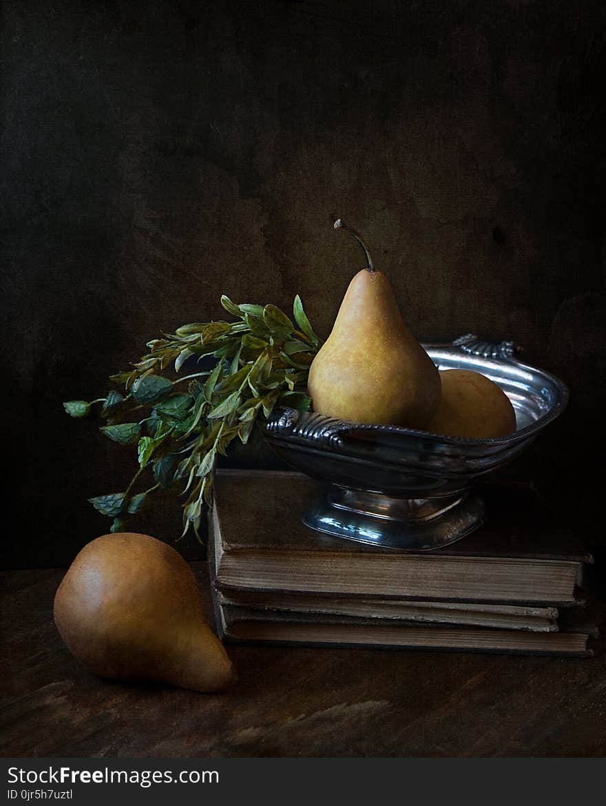 Peaches on Footed Bowl over Book