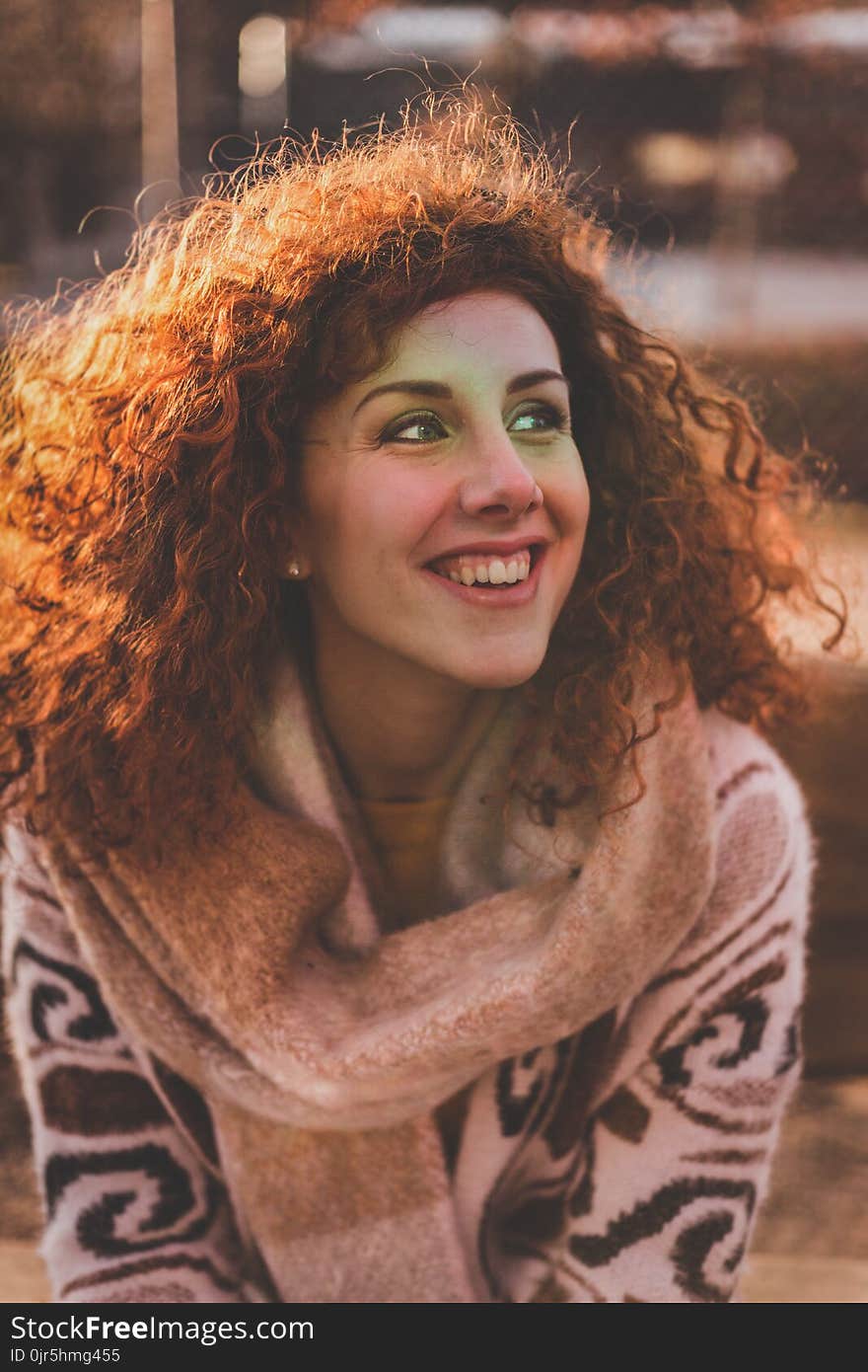 Woman With Blonde Hair Wearing Brown Sweater