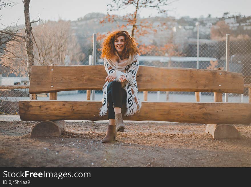 Woman Wearing Floral Cardigan Sit on Bench